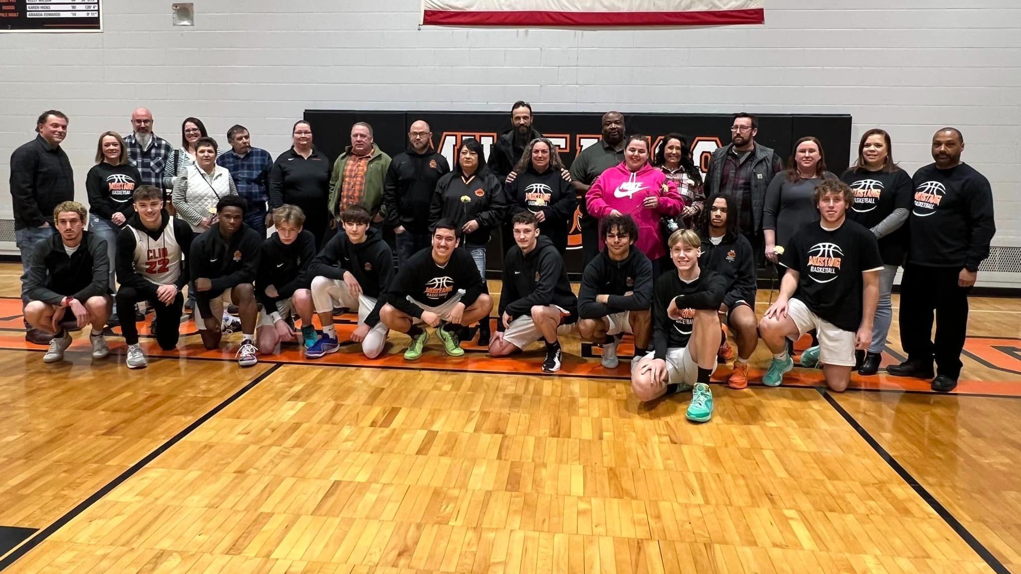 Photo of senior boys and parents from basketball team