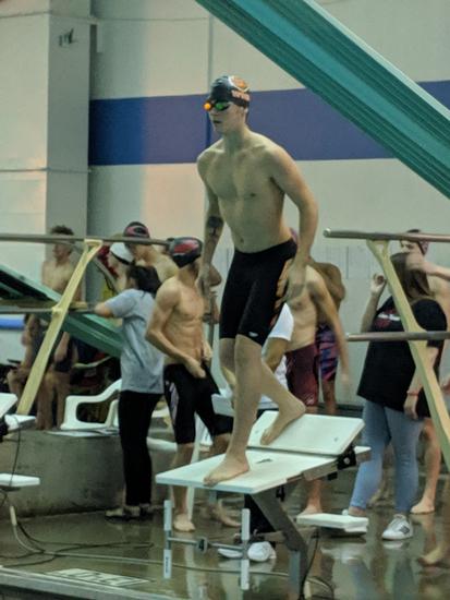 Miller preparing to dive in for the 50 Free