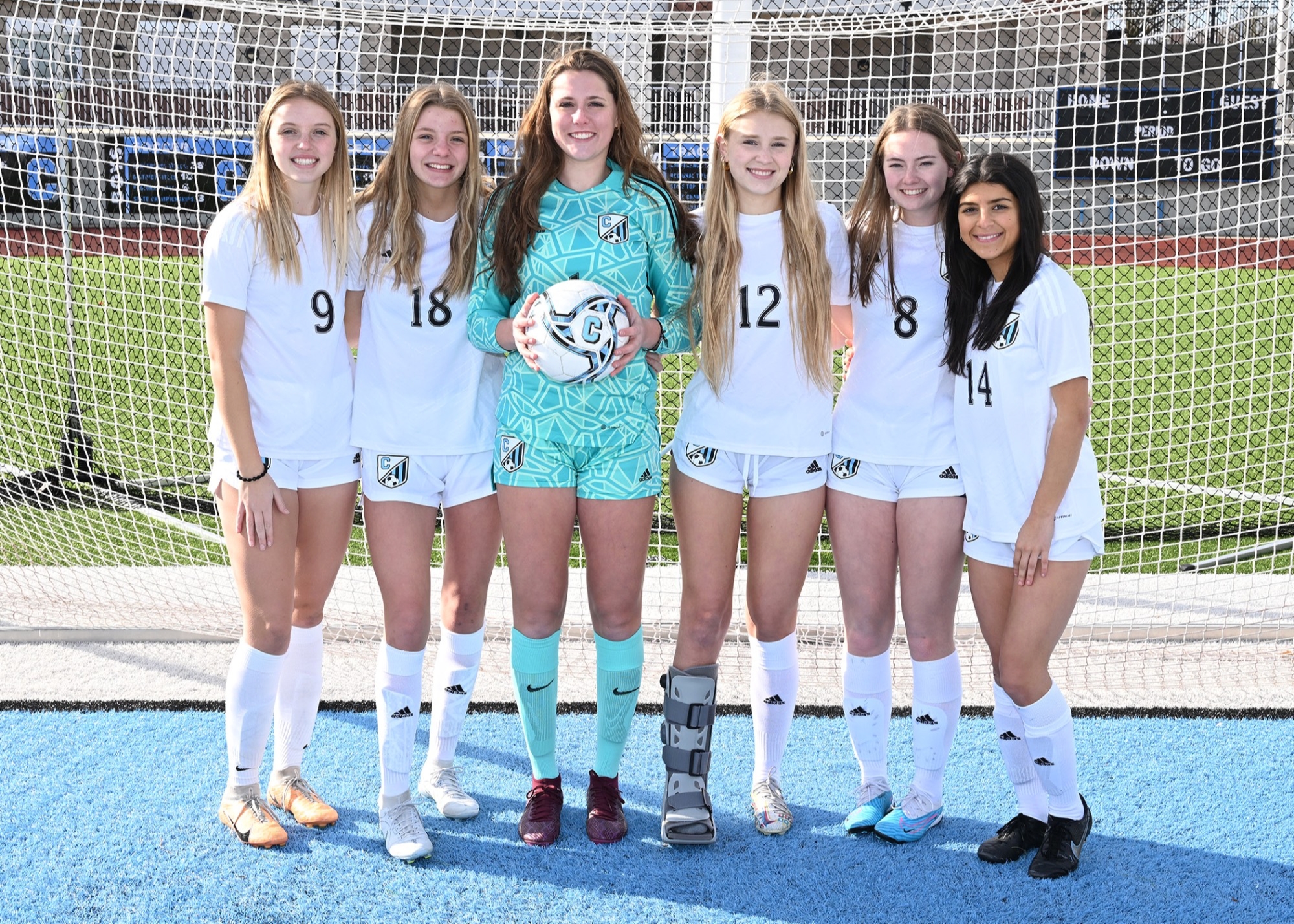 6 Grand Rapids Christian High School girl soccer players standing together