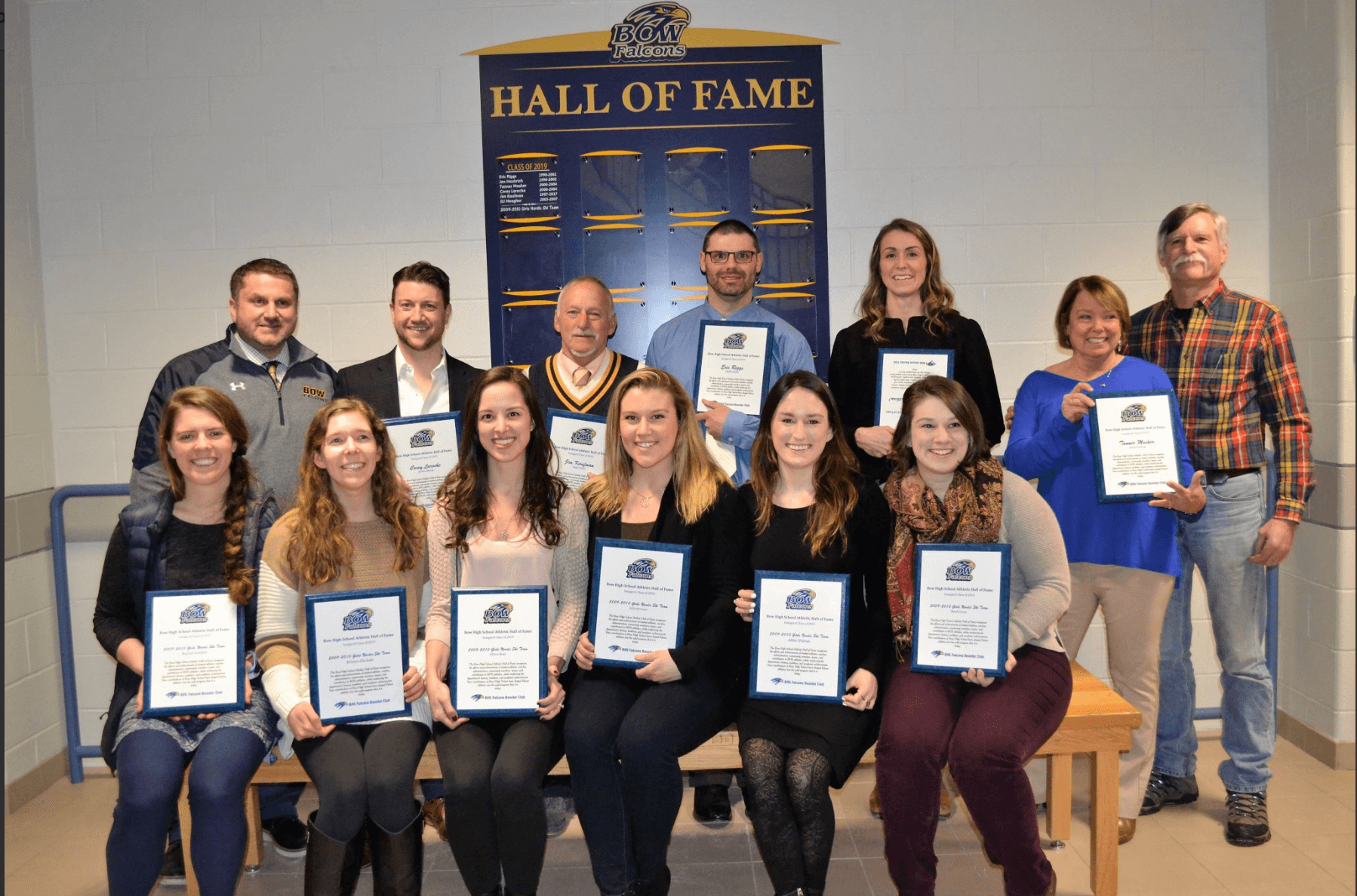 (Back row left to right: Athletic Director Mike Desilets, Corey Laroche, Jim Kaufman, Eric Riggs, Jen Haubrich (Fithian), and the parents of Tanner Mosher)  (Front row left to right: Rachel Gottlieb, Kristen Chulada, Allison Baier, Julia Romano, Abbie Holmes, and Sarah Large)
